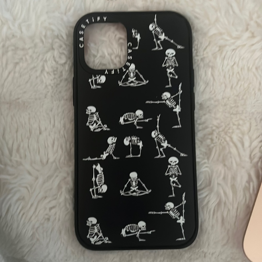 Casetify Black case with skeletons doing yoga positions for iPhone 12 mini